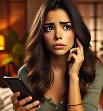 DALL·E 2024 06 23 12.49.44 A beautiful Latina young woman with olive skin and dark brown hair looking anxious as she receives a call. She is holding her smartphone and looking a