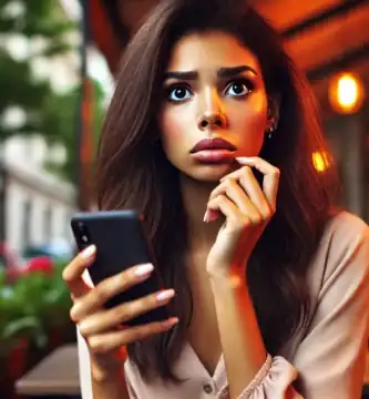 DALL·E 2024 06 23 13.21.17 A beautiful young woman with dark skin and brown hair looking nervous as she receives a call. She is holding her smartphone and looking at it with a c