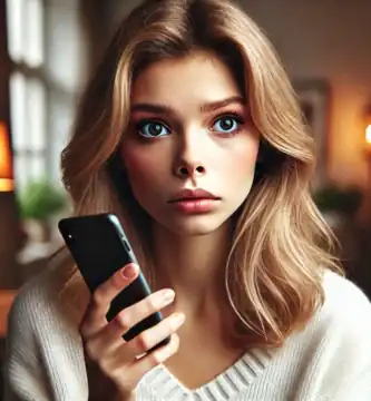 DALL·E 2024 06 23 13.21.01 A beautiful young woman with fair skin and blonde hair looking worried as she receives a call. She is holding her smartphone and looking at it with a