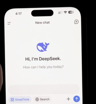 AI News DeepSeek A person holding a cell phone in their hand
