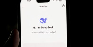 AI News DeepSeek A person holding a cell phone in their hand