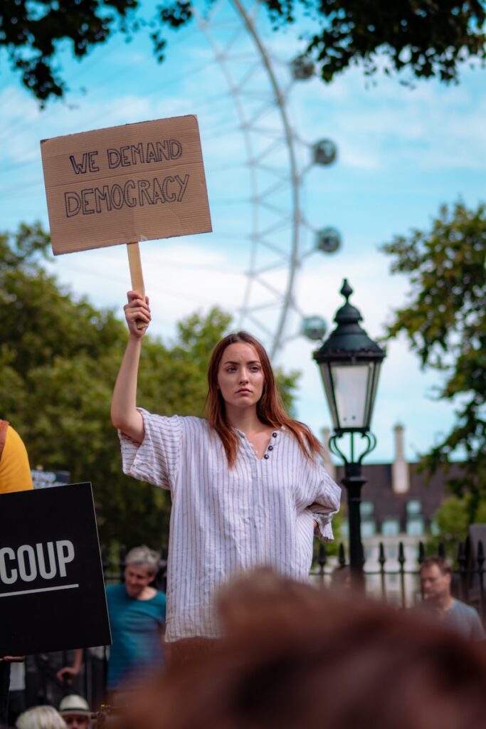 Democracia woman holding signboard