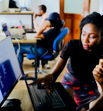 KJSEA 2025 woman and man sitting in front of monitor