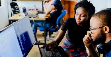 KJSEA 2025 woman and man sitting in front of monitor