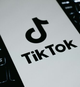 Pixverse AI trend Tiktok logo on a laptop keyboard