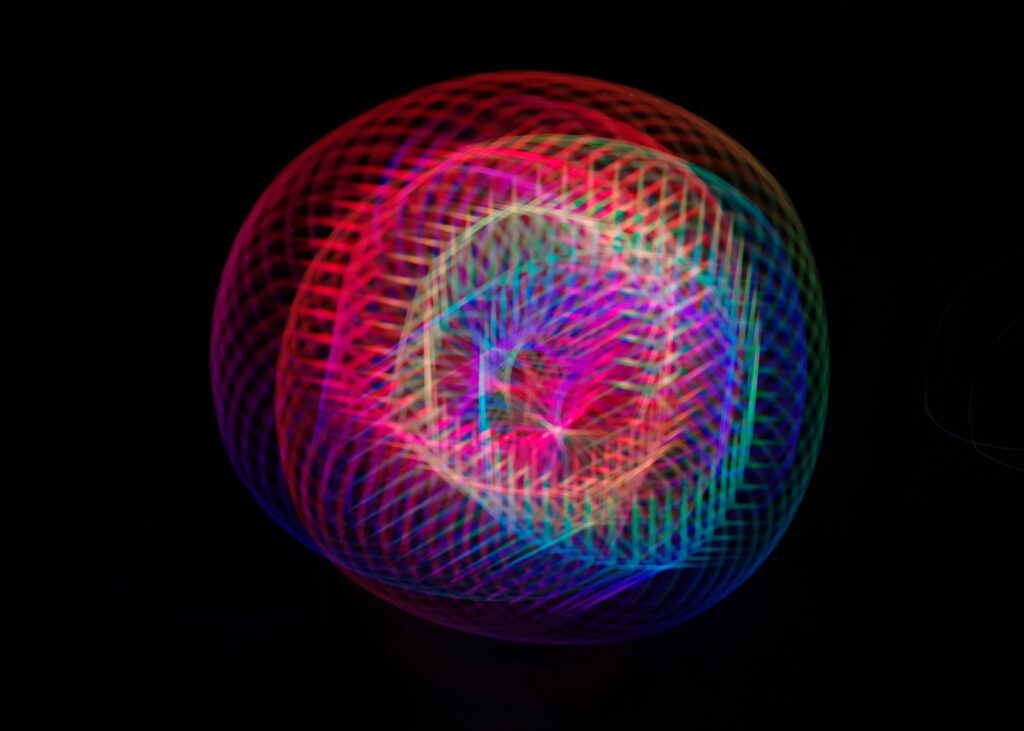 How to Use Dictation on Mac a colorful ball of light on a black background