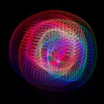 How to Use Dictation on Mac a colorful ball of light on a black background